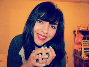 My hair used to be a medium brown. I then dyed it a black/brown color - it makes the perfect contrast with my red lips. :)