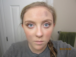 Simple natural makeup with dirt and ash because she is in the coal district.