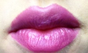 Love using purple eyeshadow over purple lipstick to create a strong, matte look. 