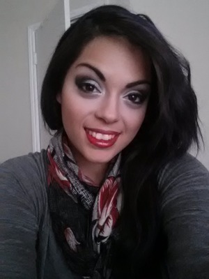 black and metallic silver smokey eye with a bright red lip

https://m.facebook.com/AshleyGMakeupByAshley