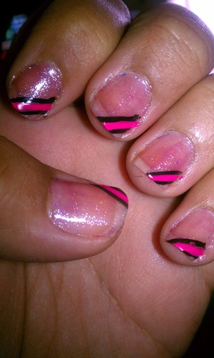 with a shier pink polish paint entire nail. with nail art polish in pink and black make a few diaginal lines then use a top coat to seal in design 