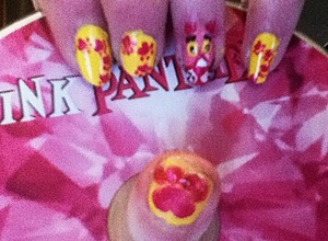 Inspired by cat Merlin who died suddenly died ode to the man of house!  the ringmaster is pink panther and the rest are dark pink paws on yellow and the thumb has a dark pink paw print with rhinestone toes :)