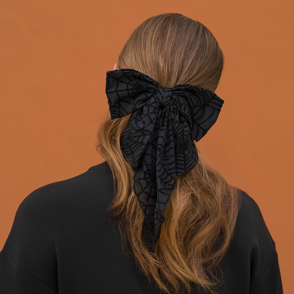 Model wearing Kitsch Oversized Bow Spiderweb