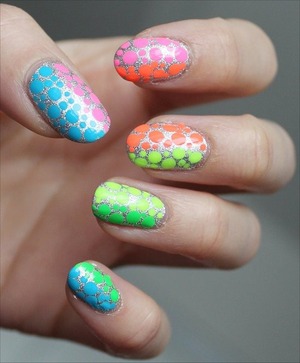 See more swatches of my manicure here and to learn the names of all the nail-polish colours I used: http://www.swatchandlearn.com/nail-art-neon-rainbow-dotticure/ 