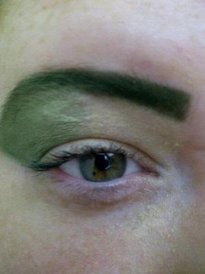 Shades of greens. Liner used for the eyebrow, to create a strong, dark defined eyebrow- with lighter shades of green shadows on the eye. 