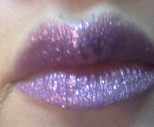 cosmetic glitter and glitter glue will be my best advice before applying glitter line your lips