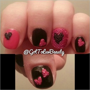 Pink and black nails decorated with caviar beads.