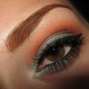 Orange And Blue Eyes With Winged Liner