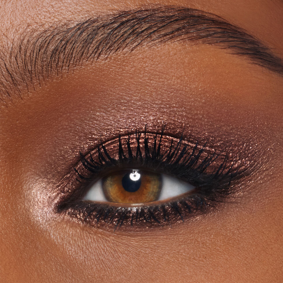 Charlotte Tilbury model wearing the Exagger-Eyes Waterproof Eyeshadow Stick in Astral Topaz
