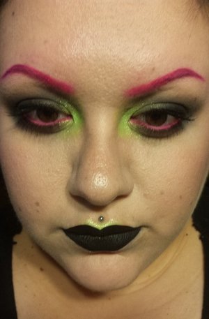 A look I wore to go see Rob Zombie and Disturbed in Atlanta in May 2016. I was inspired by some of the bright colors on the cover of Rob Zombie's newest album, The Electric Warlock Acid Witch Orgy Celebration Dispenser. I love doing bright pops of color in my inner corners! Brows and waterline are ColourPop Boots liner, green is ColourPop Fizz super shock shadow, and lipstick is Pretty Zombie Cosmetics Black Cat.