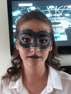 attempted a masquerade mask on my sister :) i stuck rinestones all over the place which was fiddely =P