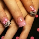 Cute nails with zebra print and bow 