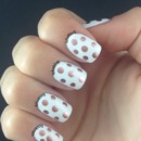 White and copper polka dot manicure