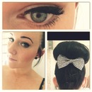 big bow bun and winged liner