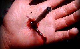 Stab in hand with pen (Special Effects Makeup)