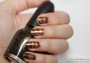 Olympic medal inspired nails. Abstract.
Tutorial here: http://strangekitty.ca/friday-nails-go-for-gold/