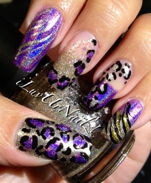 The colors I used to achieve this look are Jades Fascino Violeta, China Glazes I'm Not Lion & Snow Globe I also used Wet n Wilds Fergies Going Platinum I did some leopard prints with black acrylic paint 
http://iluvurnailz.tumblr.com/