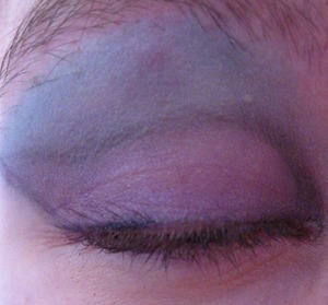I put a dark lilac shadow all over, then applied an ocean blue just above crease and on brow bone. On the crease, in my inner eye, and winged out is just some black shadow. Liquid liner would work better for that part.