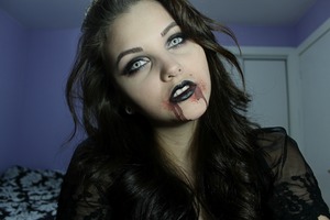 This is an old photo from Halloween but I thought I would post it anyway.
I couldn't find it to list below but the black lipstick is:
(Wet and Wild Fantasy Makers Lipstick IN Black)

I have a tutorial for this on my youtube channel 
http://youtu.be/0JHrK9a8Ab8
