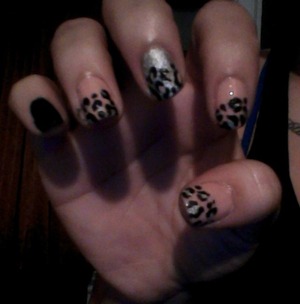 3 finger Cheetah painted with Bare Essentials- Brucci, middle Cheetah painted with Celeb City- Sally Hansen, pinky painted Black Out- Sally Hansen 