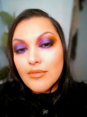 A seriously intense color scheme blown out using 9 different eye shadows and a soft orange lip. 