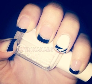 Black French tip with silver lining.  Accent on the ring finger painted white with zebra black and silver print. Covered with clear opi dry and brittle polish. 