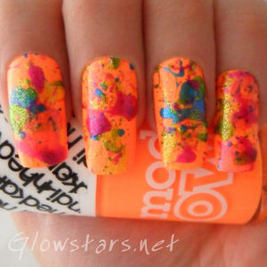 A splatter mani created using various polishes and drinking straws.