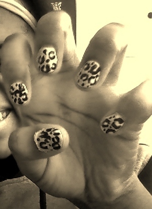 I am so proud of my self because this was my first time doing leopard print nails! I will post another pic in colour.