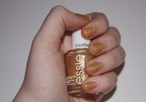 As Gold as it Gets on my nails. About two coats.