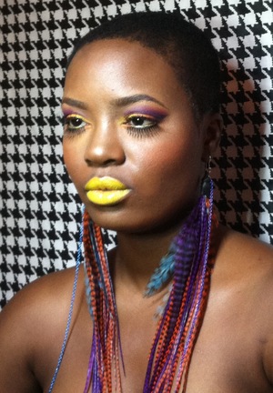 Fun with colorful lips and eyes! Accented with feather earrings!