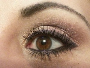 My eye makeup for this past Valentine's Day.  I went with Half Baked Eyeshadow by Urban Decay(shimmery gold) on my inner lid with a matte brown in my crease.  I used Last Call by U.D. (a shimmery maroonish pink) on my outer lids and brought that up to meet the matte white color for my brow highlight.  I finished it with Plum Eyeliner from Smashbox and a few coats of mascara by Urban Decay. 
 Oh, and I ran Smog by U.D. under my lower lash line along with the eyeliner from Smashbox. 