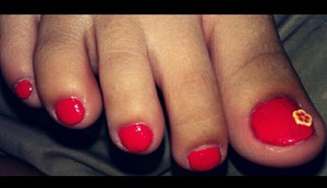 tangerine orange toes with flower fimo accent!! :)
