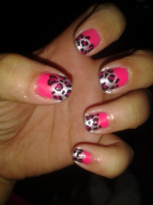 pink and silver back.ground with a dark pink and black cheetah print 
