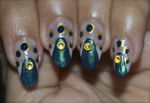 See the video tutorial https://www.youtube.com/watch?v=BpESw4Zw_24
For more pics visit http://www.gorgeousnailschannel.com/2014/11/peacock-nail-art-design.html

Follow me on :- 
YouTube : https://www.youtube.com/user/SuperGorgeousnails 
Blog : http://www.gorgeousnailschannel.com 
Facebook : https://www.facebook.com/SuperGorgeousNails 
Twitter : https://twitter.com/DemiNails123 
Pinterest: http://www.pinterest.com/deminails123/