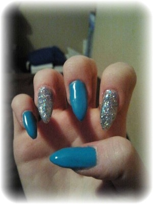 turquoise & silver nail varnish over stiletto shape gel nails