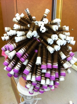 If you ask for a spiral perm, expect about this many rollers and one ole heck of a headache from how heavy they are.