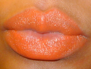 Morange is an amplified cream lipstick that provides full coverage, and bold neon color.