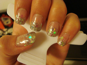 Clear gel nails with silver sparkles.