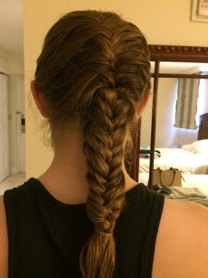 Do as you would a regular french braid only doing the fishtail braid method