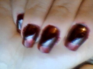 left hand "blood drops" using a dark red/purple (Avon's Tweed) followed with bright red sparkles at the tip (Avon's ruby slippers) with a silver "reflection" on the edge and lining the tips to create a "drying" look