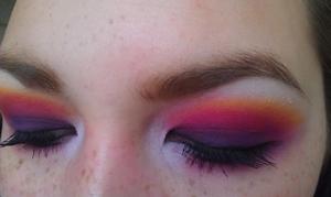 A blend of a deep purple with pink/red and yellow