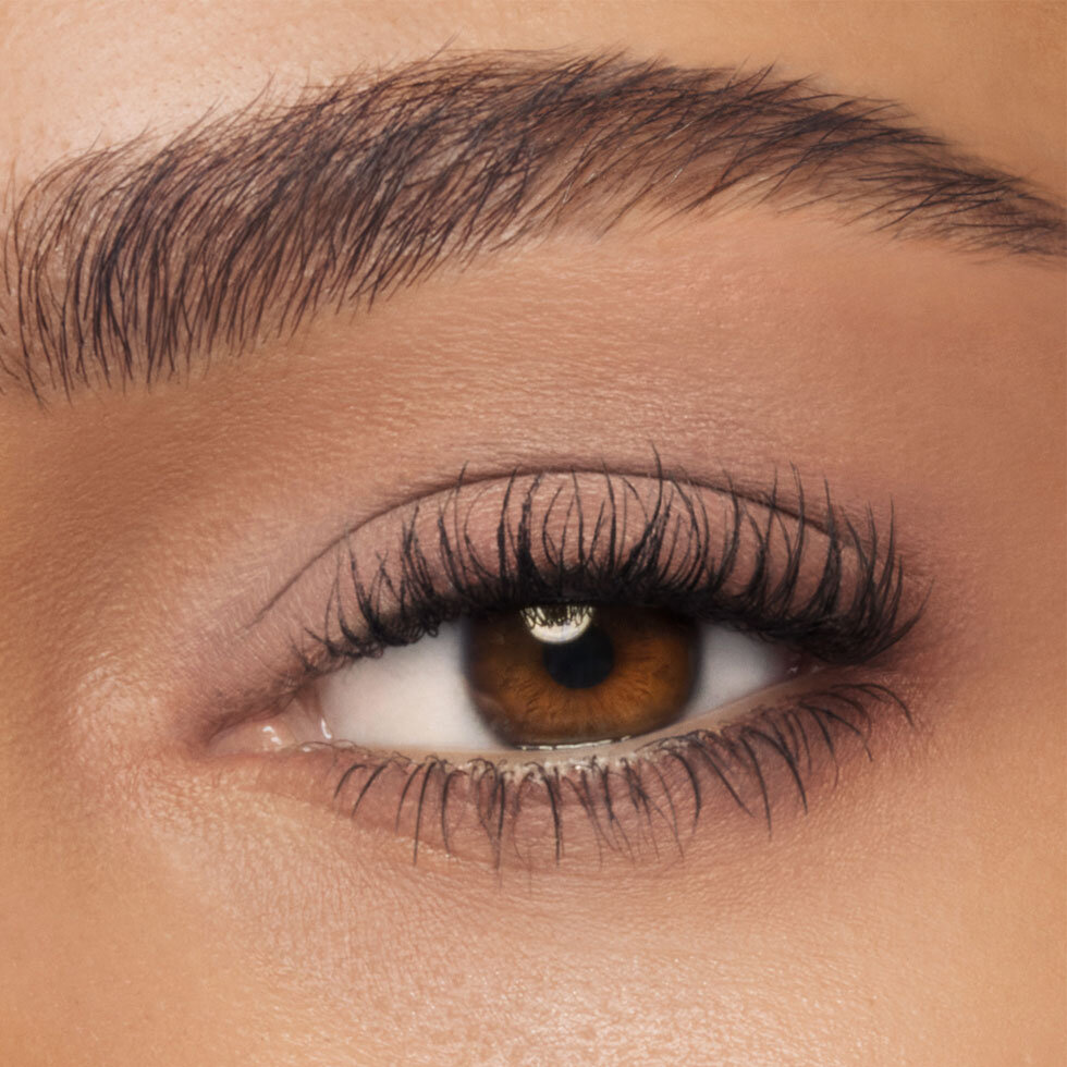Charlotte Tilbury model wearing the Exagger-Eyes Waterproof Eyeshadow Stick in Nude Sculpt