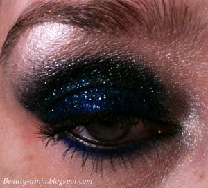 I used Chaos and Black Market from the Urban Decay Vice palette, with black an blue glitter over them. I then used MUG Shimma Shimma on my browbone to highlight. 