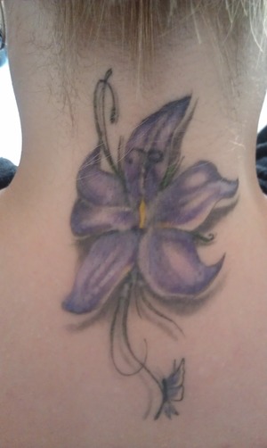 My purple flower tatoo on the back of my neck