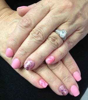 I did these on my mom. She's more conservative than I so she wouldn't let me stamp all of them, just the pinky's. I used OPI Pink of Hearts, I think in pink as the base and you glitter be good to me on the ring fingers. Mash stamp for the ribbons and stamped with OPI feelin' hot hot hot! 