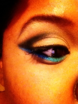 Arena e/s on the lid, Saddle in the crease, with Carbon, blended to the outer corner. Some Loreal HIP Bright e/s duo in Flare (Beige color) which was also mixed with Arena on the lid. Maybelline Eye Tattoo in Tenacious Teal, with Deep Truth e/s blended to fade into each other. Eye studio Gel liner in Blackest black. Brows shaped and filled with Embark e/s all products of MAC except Liners. 