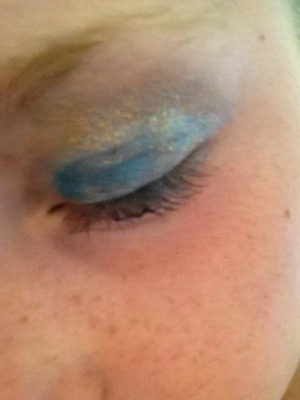 Blue eye shadow and a bit of Gold glitter