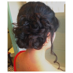 Prom Updo: Soft curled bun with braids throughout. ✌