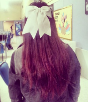 red hair, top pulled pack with bow