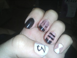 Witchcraft Black and White; Opi black; KONAD stamping; wet n wild 2% Milk. I admit it's a little messy!
